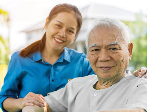 A photo of a young woman with an elderly man