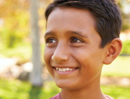 A photo of a young boy smiling