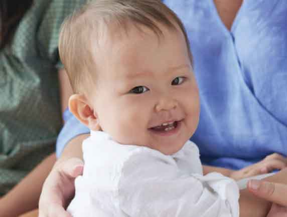 a photo of an infant smiling