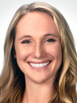 A woman smiling.