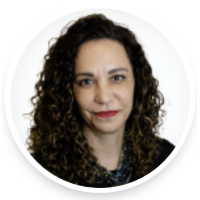 A woman with curly hair smiling