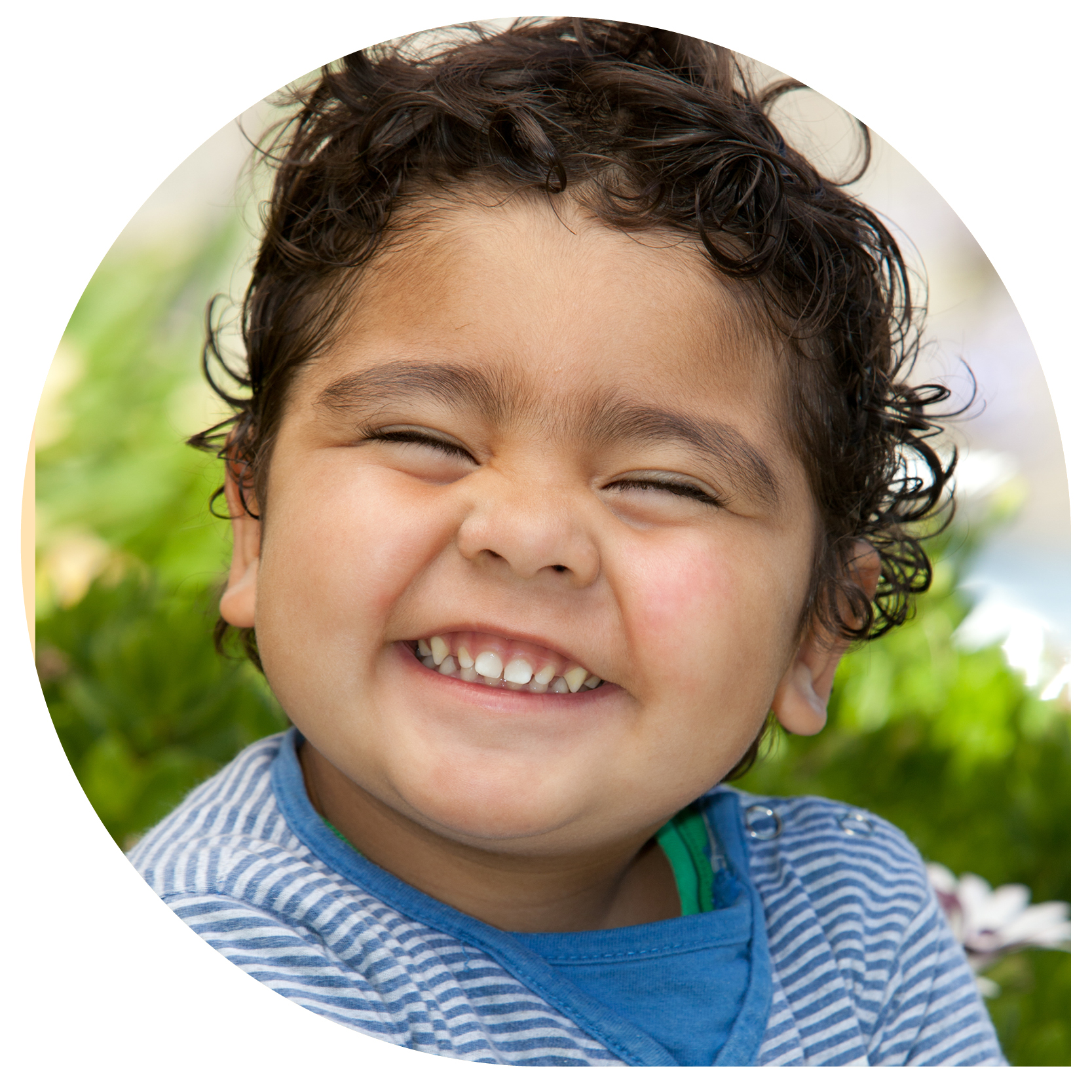 A mother and her toddler son smiling